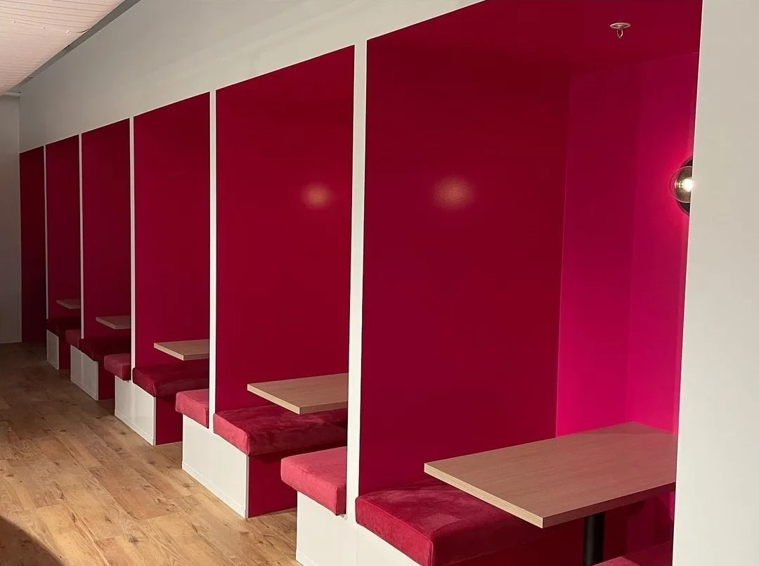 Commercial repaint, magenta booth seating in a venue, Sydney