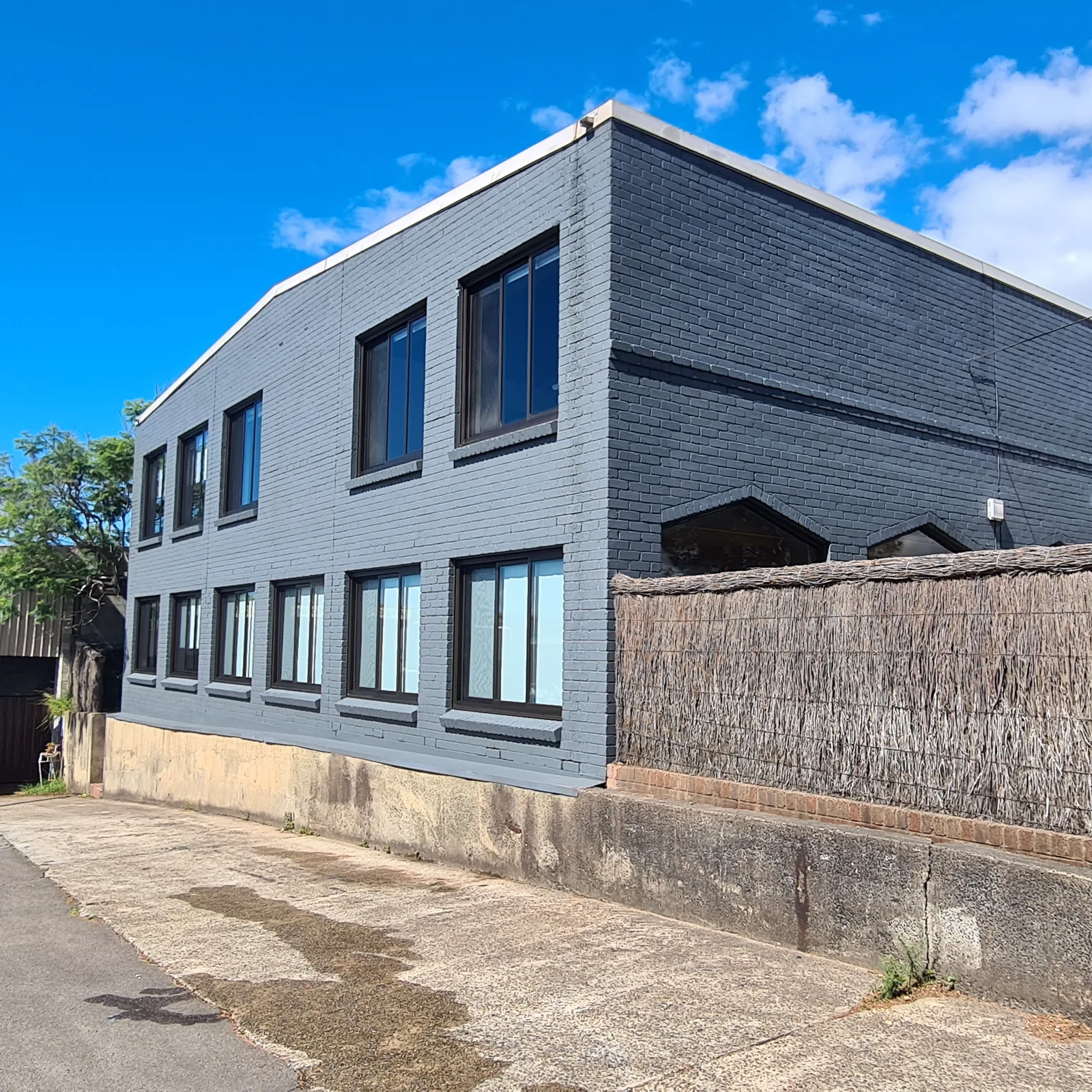 Commercial repaint, two storey painted brick industrial exterior, Sydney