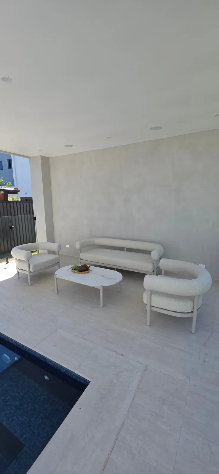 Exterior repaint, covered poolside lounge with polished render wall, Sydney