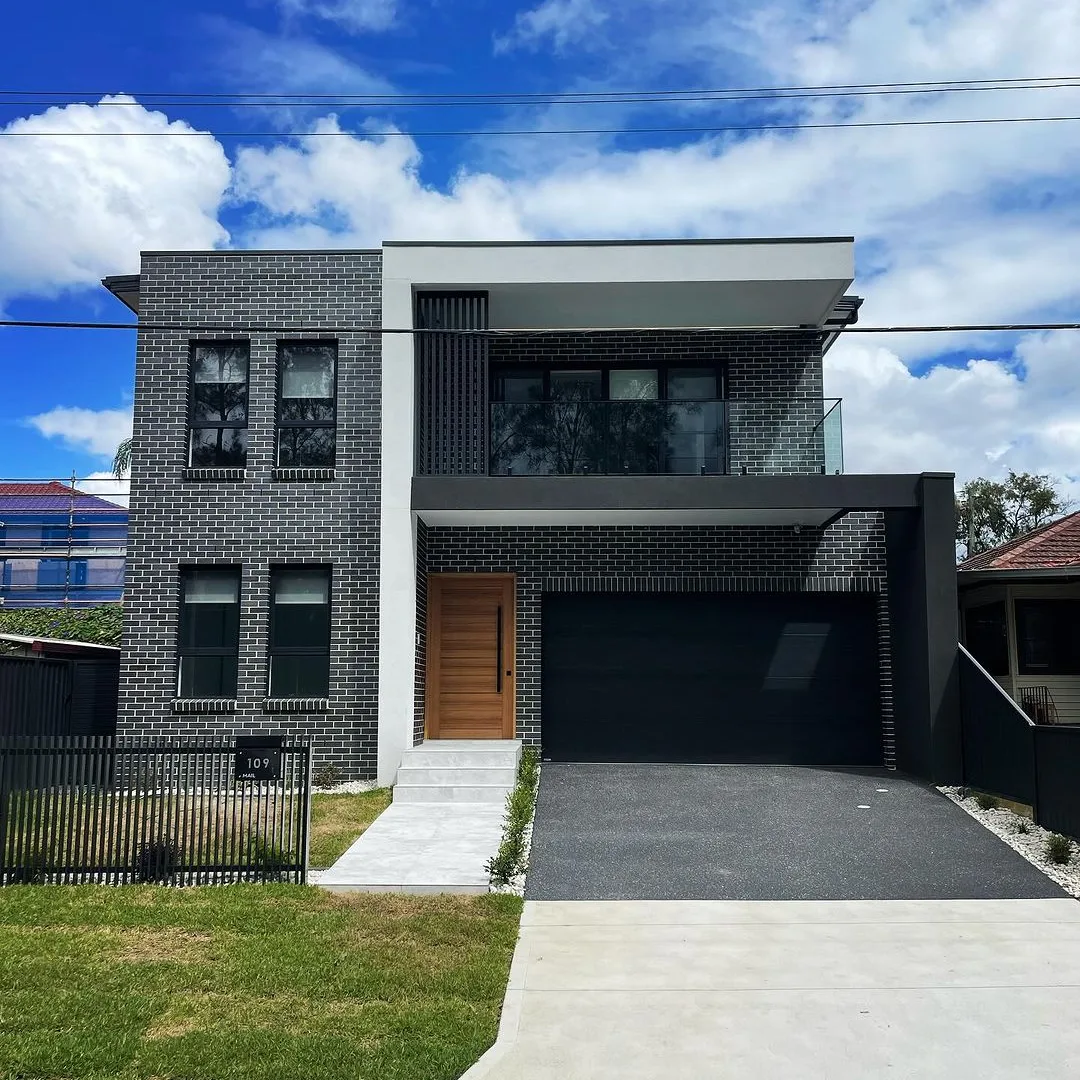 Exterior repaint, dark brick two storey home with timber door, Sydney