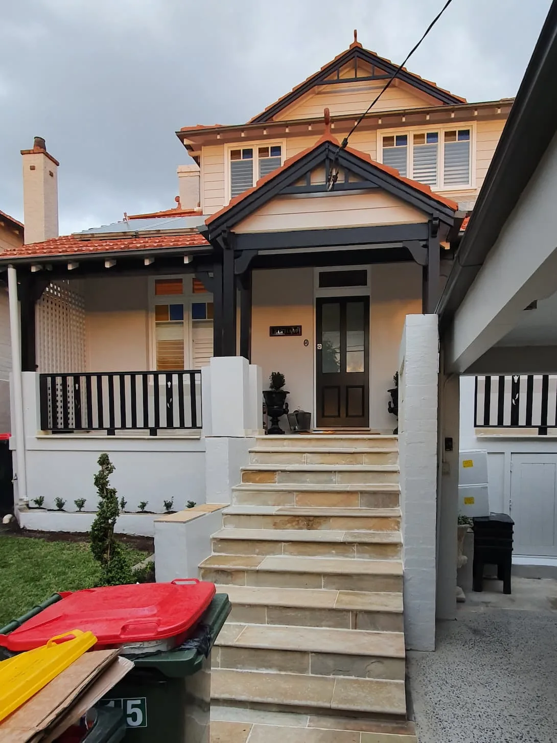 Exterior repaint, Federation home in cream with charcoal timber trims and gable, Sydney