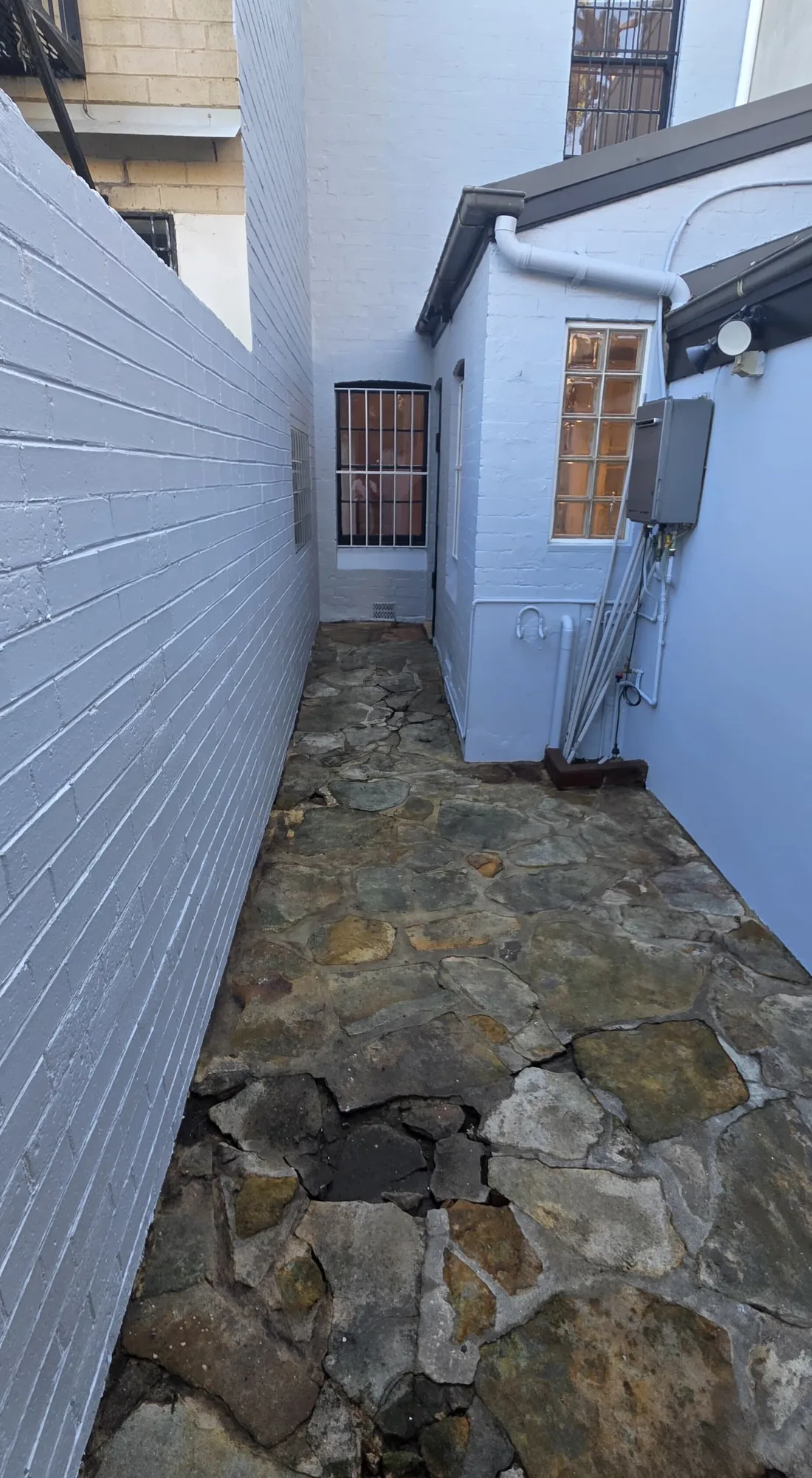 The same side passage and courtyard after repainting, Sydney