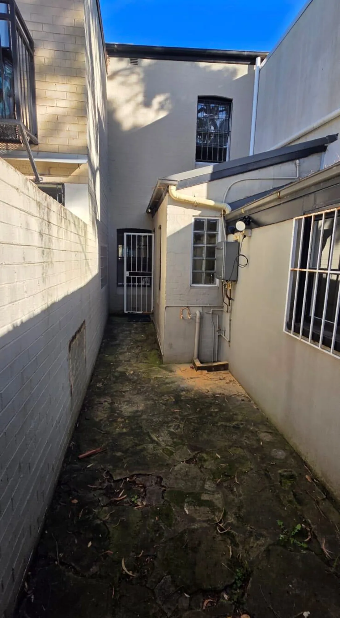 Side passage and courtyard before repainting, Sydney
