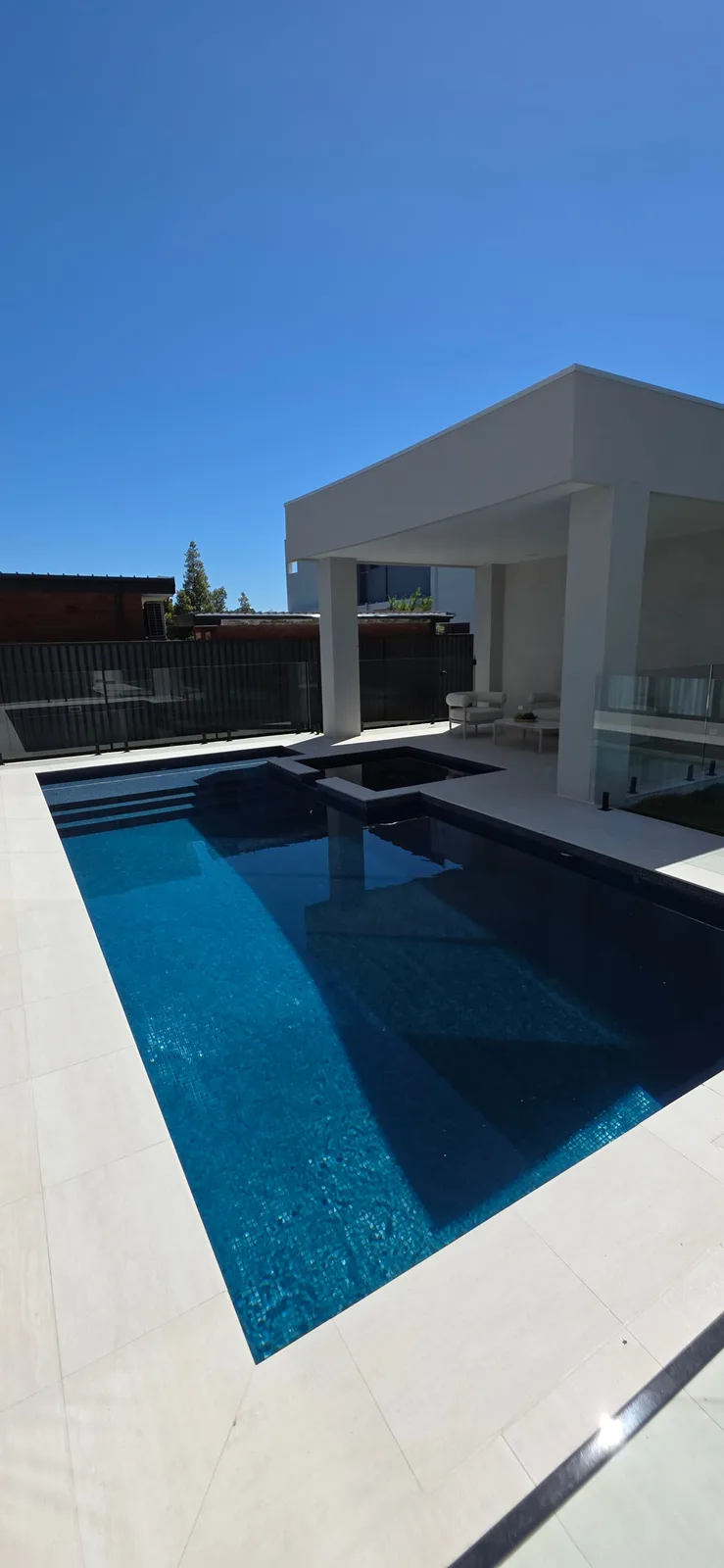 Exterior repaint, white rendered pool cabana and terrace, Sydney