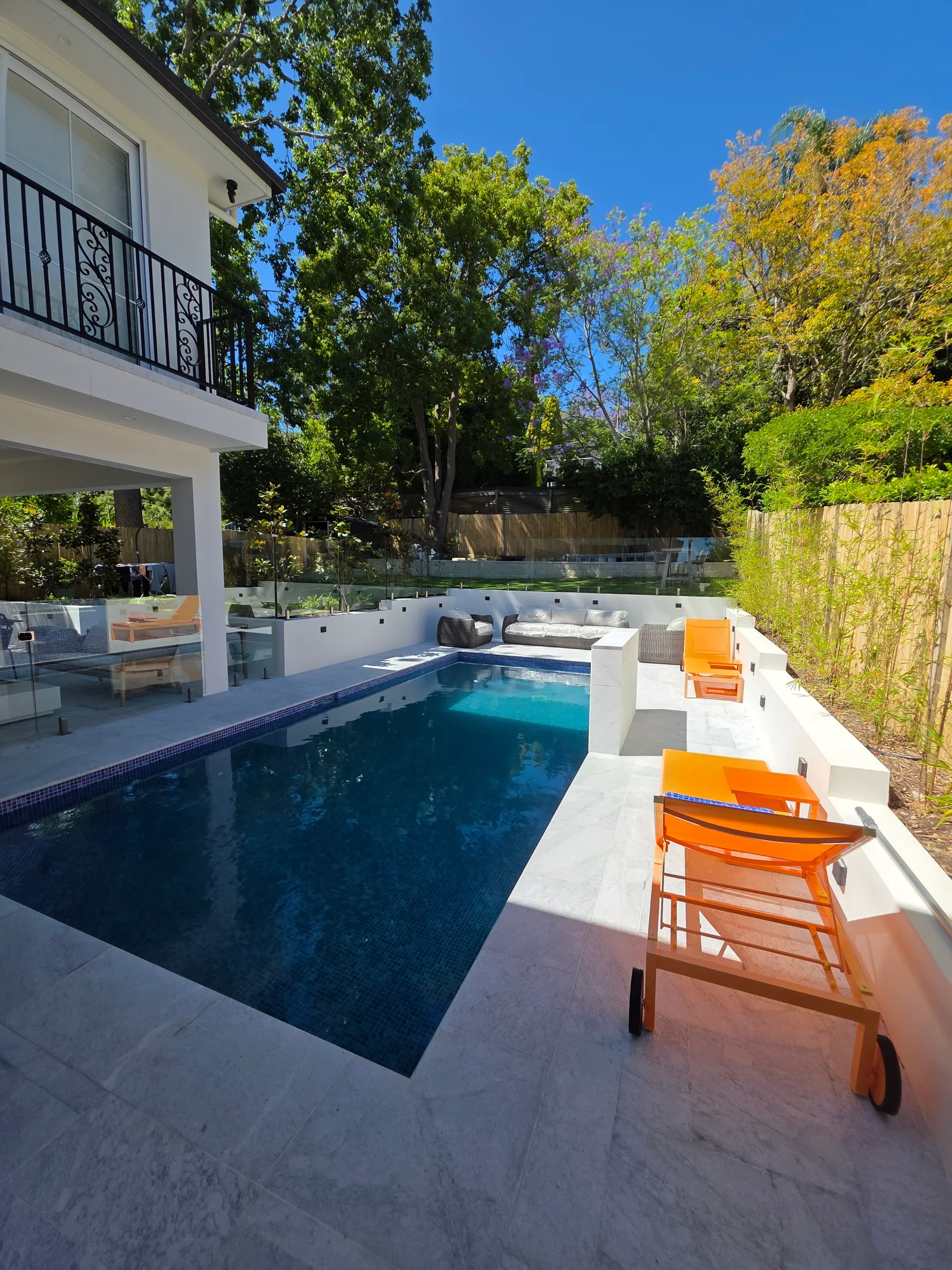 Exterior repaint, white rendered home and pool surrounds, Sydney