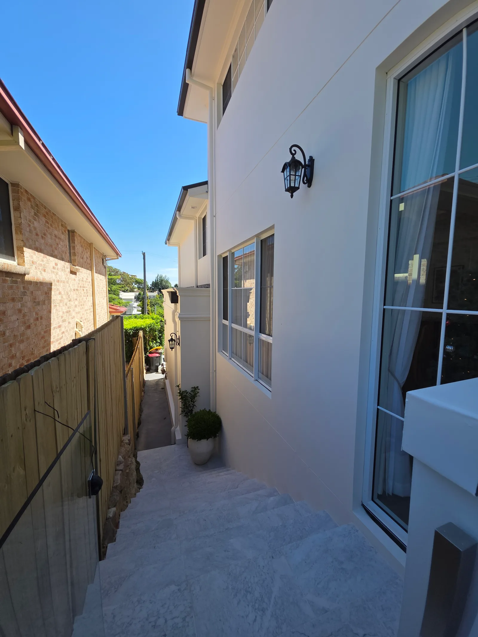 Exterior repaint, rendered side passage and eaves, Sydney