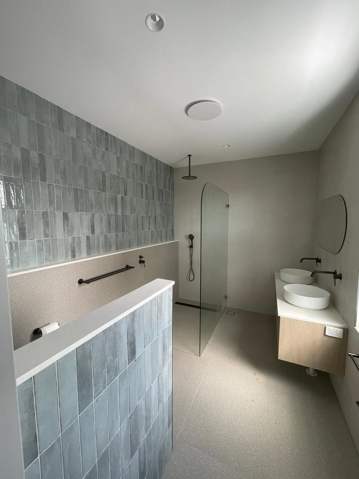 Interior repaint, bathroom with blue vertical tiling, Sydney