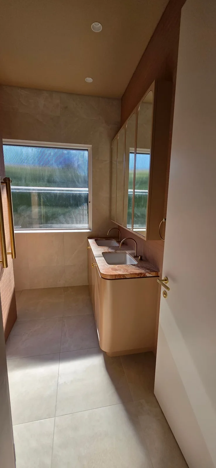 Interior repaint, bathroom with blush vanity, onyx top and arched mirror cabinets, Sydney