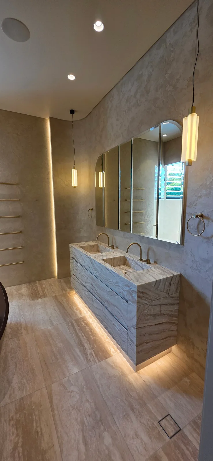 Interior repaint, travertine bathroom with stone double vanity and brass pendants, Sydney