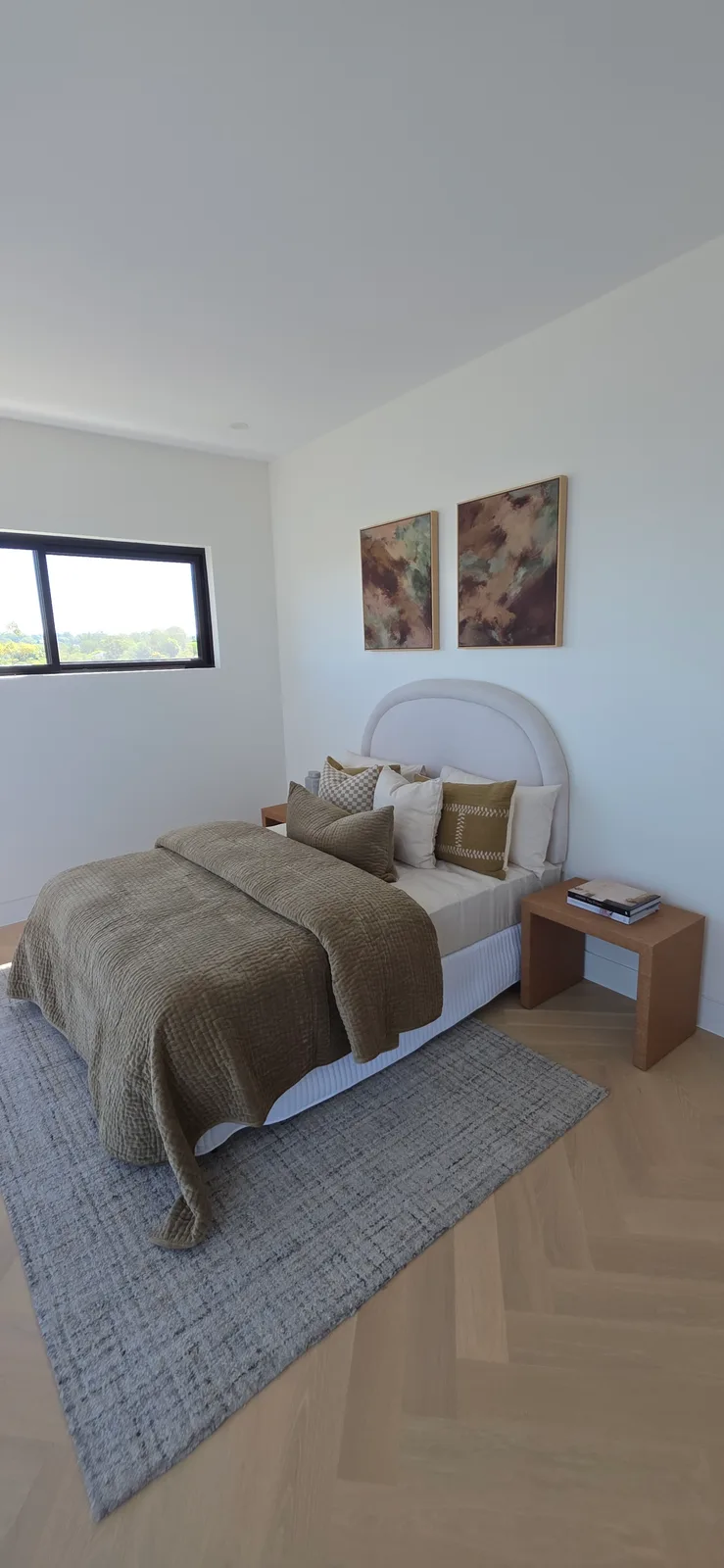 Interior repaint, bedroom with arched bedhead and olive bedding, Sydney