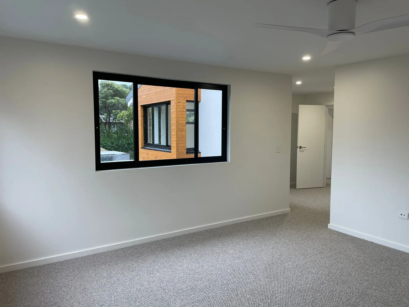 Interior repaint, carpeted bedroom and picture window, Sydney