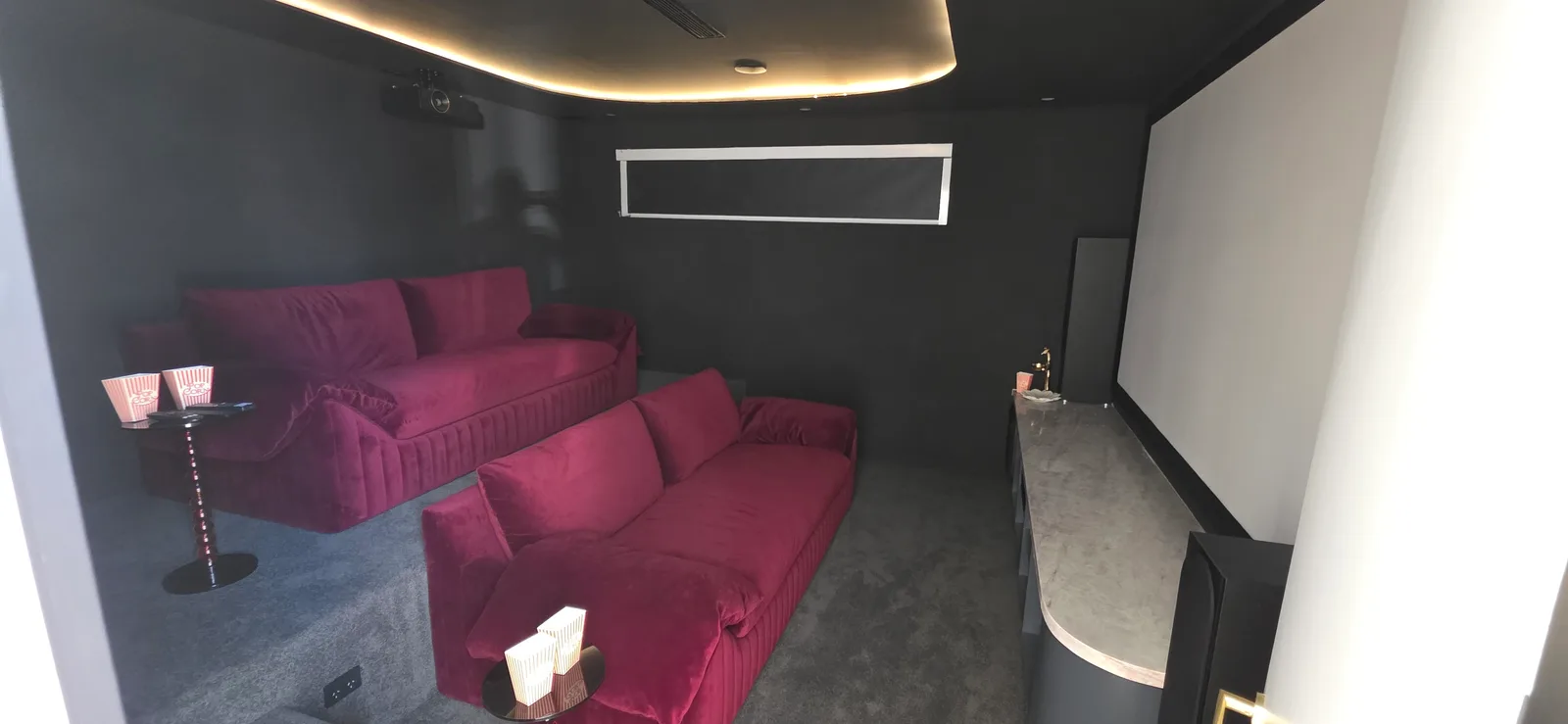 Interior repaint, home cinema in charcoal with magenta seating, Sydney