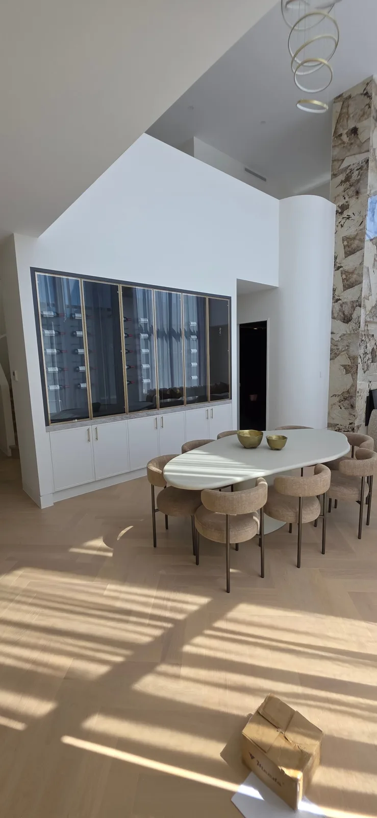 Interior repaint, dining room with glazed wine wall and oval table, Sydney