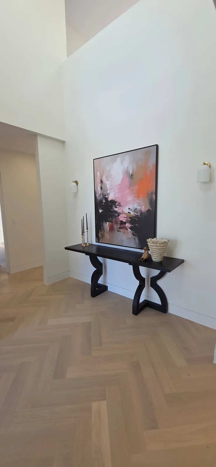 Interior repaint, double height entry with black console and herringbone floor, Sydney