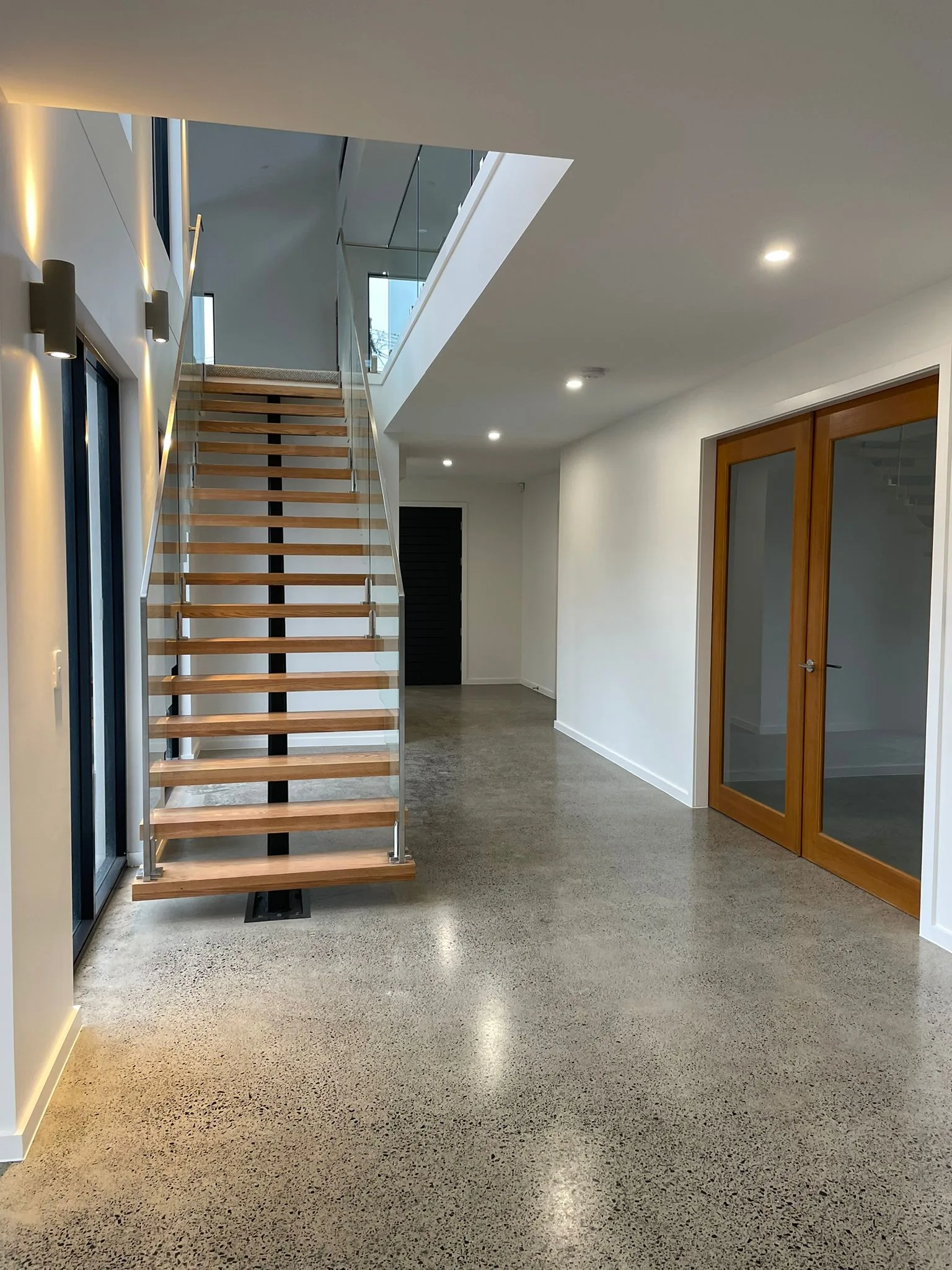 Interior repaint, hallway and floating stair over polished concrete, Sydney