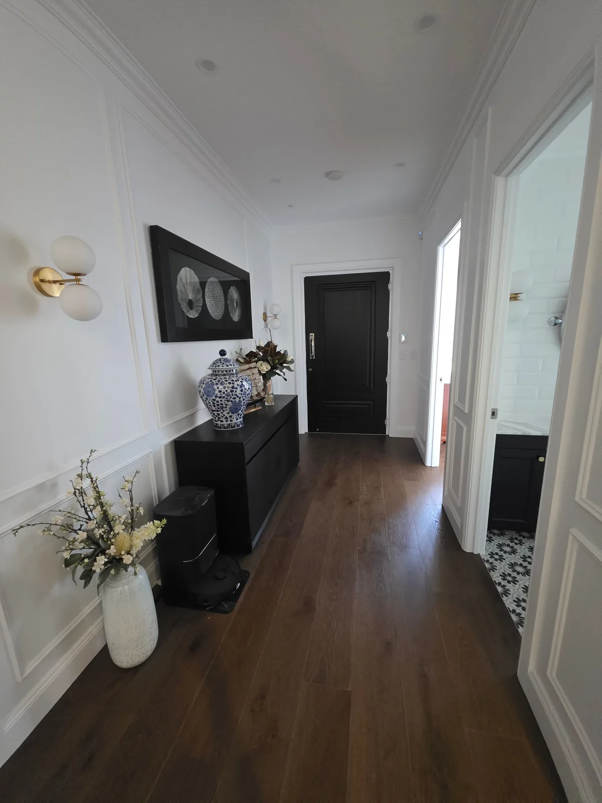 Interior repaint, panelled hallway leading to a black front door, Sydney
