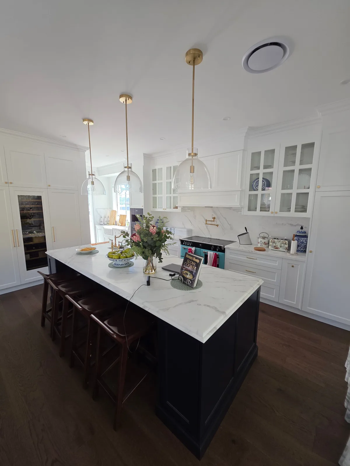 Interior repaint, Hamptons kitchen with navy island and glass pendants, Sydney