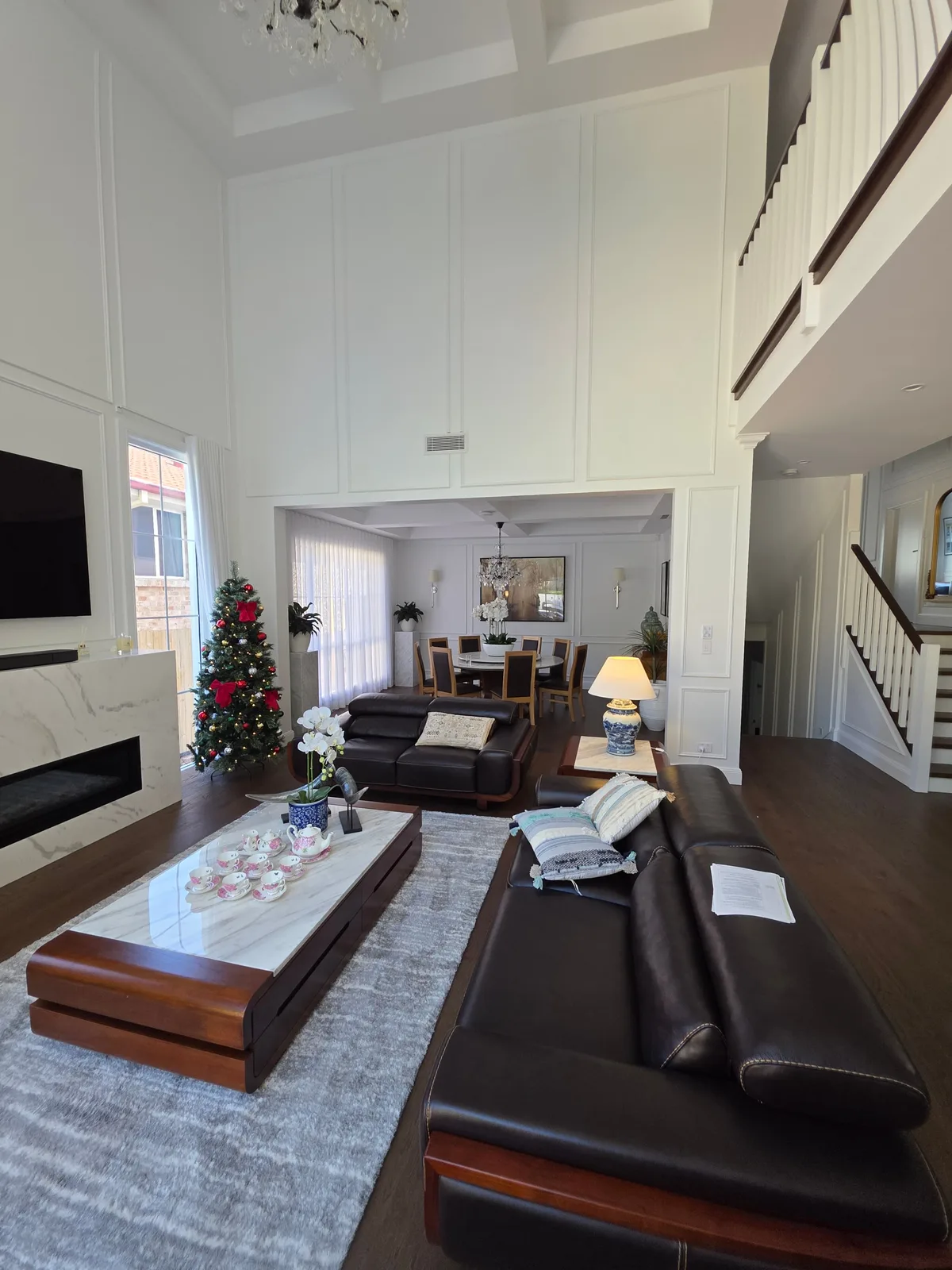 Interior repaint, double height panelled living room with marble fireplace, Sydney