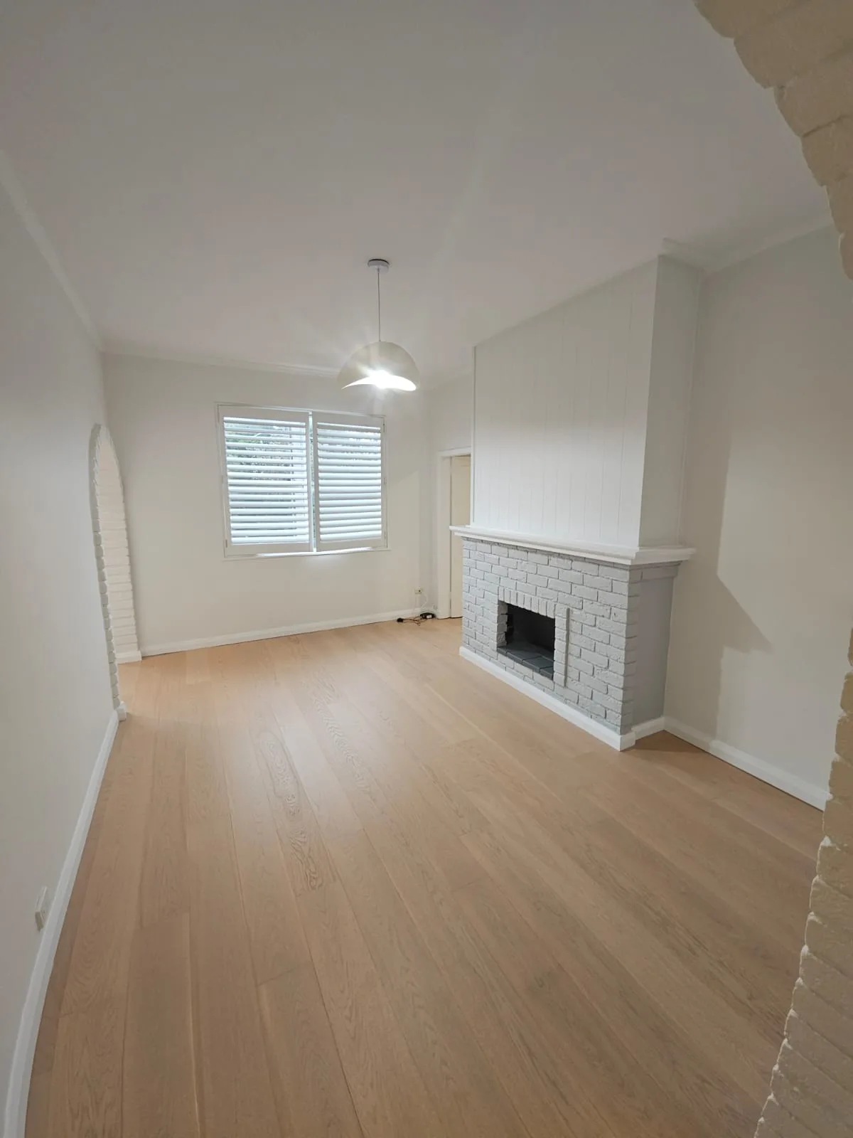 Interior repaint, living room and painted brick fireplace, Sydney