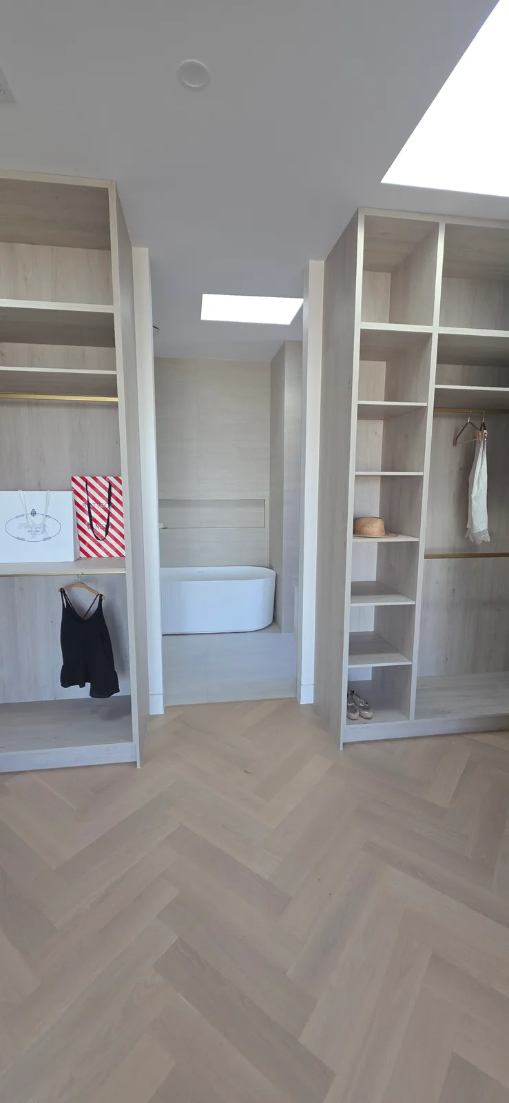 Interior repaint, open walk in robe over herringbone oak with the ensuite beyond, Sydney
