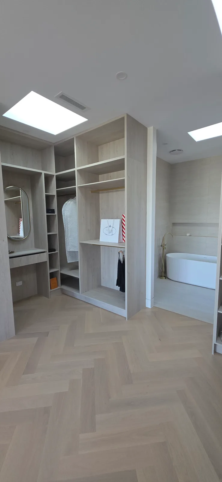 Interior repaint, walk in robe in pale oak under skylights, Sydney