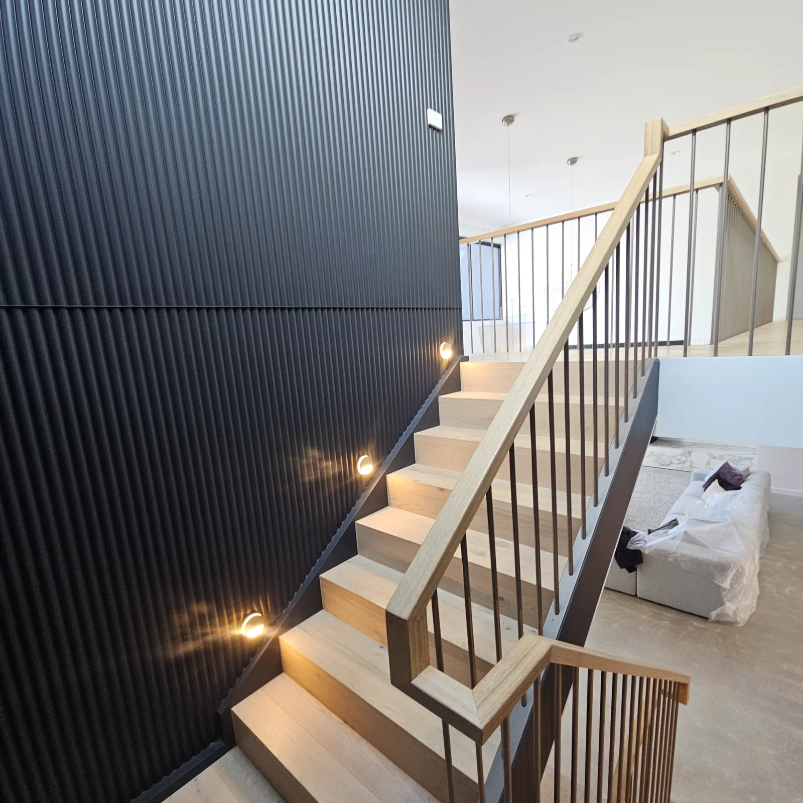 Interior repaint, stairwell and black fluted feature wall, Sydney