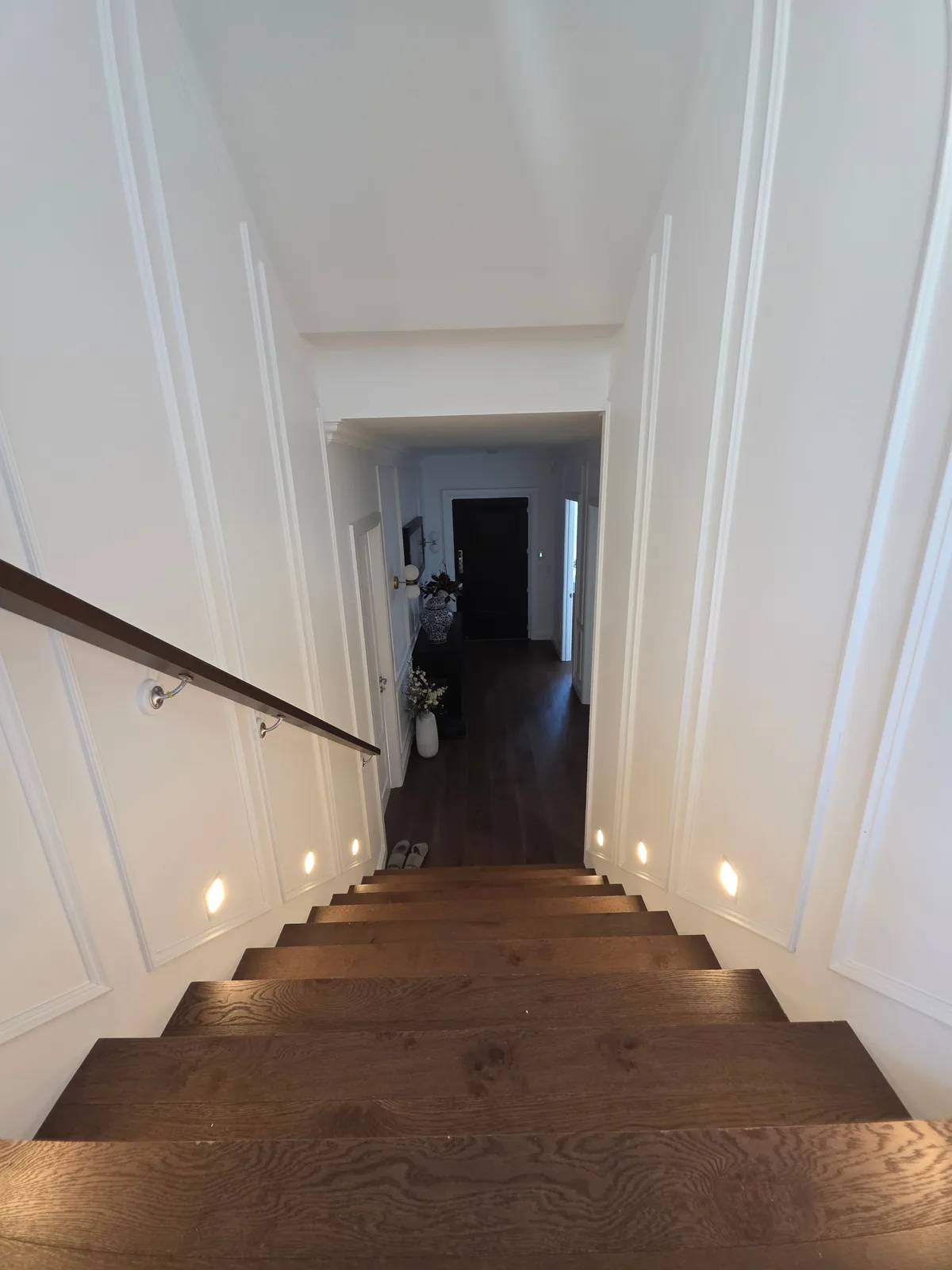 Interior repaint, panelled stairwell looking down to the entry hall, Sydney